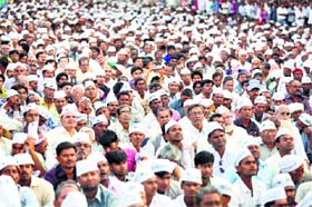 AAP supporters attend a public meeting in Ahmedabad
