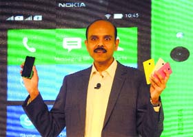 Nokia India managing director P Balaji at the launch of Nokia X Series smartphone in New Delhi on Monday. It is priced at Rs 8,599