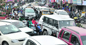 City choked with heavy traffic jam due to poor traffic maintenance on Rajpur Road in Dehradun on Monday.