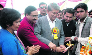 Chief Minister Harish Rawat and former Chief Minister Ramesh Pokhriyal Nishank light the traditional lamp during the students week celebrations at Shaheed Durga Mall College at Doiwala in Dehradun on Monday.