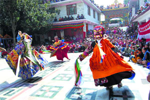 Buddhists perform the Chham dance at Rewalsar on Monday. 