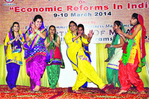 MBA students of Government College perform the giddha at a national seminar in Dharamsala on Monday. 