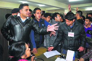 SFI activists gherao the Additional Chief Warden at HPU in Shimla on Monday.