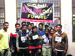Students of the Law Department on a fast at the Chaudhary Devi Lal University campus in Sirsa on Monday. 