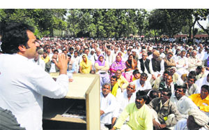 HJC supremo Kuldeep Bishnoi addresses a workers meeting in Hisar on Monday.