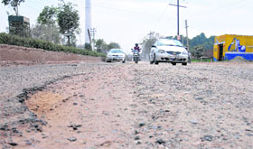 Potholes that are an obstacle for the commuters at Nakodar road in Jalandhar.