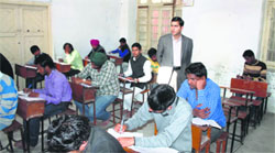 Deputy Commissioner Rajat Aggarwal inspects an examination centre. A Tribune Photograph