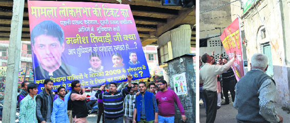 Activists of the Shiv Sena protest against MP Manish Tewari on Monday; and (right) workers of the Congress remove posters pasted by the Sena workers at the Congress office. Photos: Inderjeet Verma