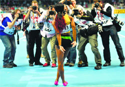 Jamaica's Shelly-Ann Fraser-Pryce poses for photographers after winning the women's 60m final in the World Indoor Athletics Championships at the ERGO Arena in Sopot. Reuters