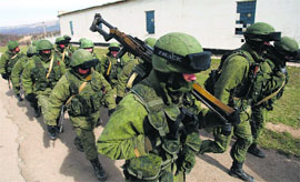 Armed men, believed to be Russians, outside a Ukrainian military base near the Crimean city of Simferopol on Monday.