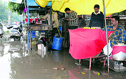 Water accumulates on Mall Road following the rain