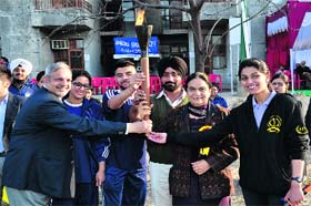 Students and staff members with the torch during the annual sports meet at the Adesh Institute of Medical Sciences and Research in Bathinda on Tuesday
