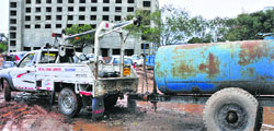 An abandoned water tanker being taken away by the enforcement wing of the Municipal Corporation, Chandigarh, from the Industrial Area, Phase II, on Tuesday. Tribune photo: S Chandan
