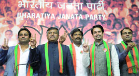 BSP leader Kalyan Singh, JDU leader Nikhil Tyagi and independent candidate O.P. Yadav join the BJP during a press conference at the party headquarters in New Delhi on Tuesday.