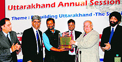 Rajneesh Kumar Jain, secretary of Avani, receives the CIIs annual green award at a function in Dehradun on Tuesday