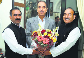 Pradesh Congress Committee president Sukhwinder Singh Sukhu and Health Minister Kaul Singh Thakur greet Union Minister Ghulam Nabi Azad in New Delhi on Tuesday.