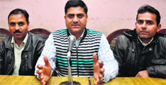 President of the Youth All India Kashmiri Samaj RK Bhat addresses mediapersons in Jammu on Tuesday. Tribune photo: Anand Sharma