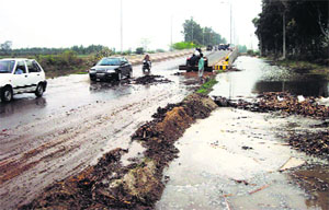 Overflowing canal water on the national highway 10 near Abohars Dangarkhera village.