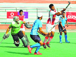 Railways (in blue) beat Food Corporation of India 3-0 in their Division A league match of the hockey Nationals on Tuesday.