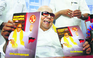 DMK chief M Karunanidhi releases the partys manifesto for the Lok Sabha polls in Chennai on Tuesday. 