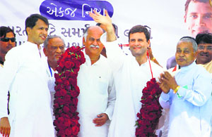 Congress vice-president Rahul Gandhi waves at crowd during a rally at Balasinor in Gujarat.