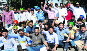 Students stage a dharna outside the Vice-Chancellors office at Panjab University on Wednesday. 
