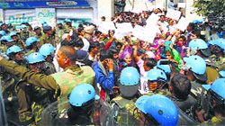 The police prevent members of the Shoshit Samaj from stopping trains at Tohana in Fatehabad on Wednesday. A Tribune Photograph
