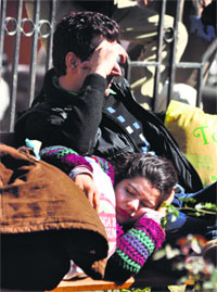 A couple enjoys a sunny Wednesday after several days of inclement weather at a park in Jammu.
