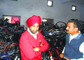 Sangrur MP Vijay Inder Singla with SDM Bakhtawar Singh at a school, where bicycles have been assembled, in Moonak on Wednesday