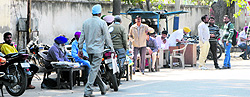 Illegal agents work on the road outside the Civil Surgeons office in Amritsar on Thursday
