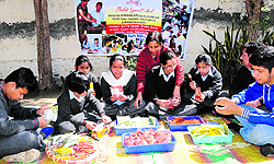 Special children at Ibadat school make and package natural colours of Holi made from flowers, in Amritsar