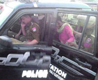 A woman worker of the Aam Aadmi Party being dissuaded by a constable from entering a police vehicle in Bathinda on Thursday evening. DSP Gurjit Romana said the constable was trying to prevent the woman AAP worker from entering the vehicle.