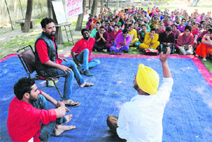 Members of the Awam Rang Manch present a play at the Regional Centre of Punjabi University in Bathinda on Thursday.