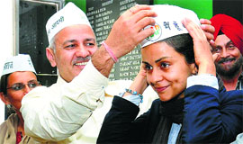 AAP leader Manish Sisodia with party nominee Gul Panag in Chandigarh on Thursday.