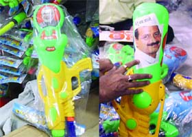 Water guns (pichkaris) bearing the pictures of Narendra Modi and Arvind Kejriwal being sold ahead of Holi at Sadar Bazar in Delhi on Thursday