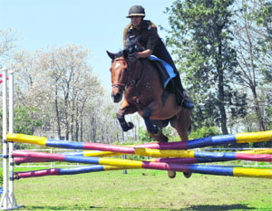 An RIMC student shows his skills during a horse show at the 92nd Founders Day and reunion meet in Dehradun on Thursday. 