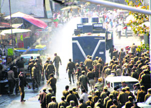 The police use water cannons to disperse agitators in Rohtak on Thursday.