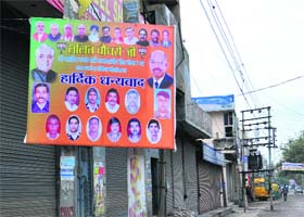 Poll Code Violation? Election model code of conduct being violated as the hoardings with photos of political leaders are on display at Avtar Nagar in Jalandhar