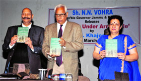 Governor NN Vohra releases Pakistan Under Army Rule, a book written by former DGP MM Khajooria at the Police Auditorium in Jammu on Thursday.