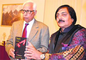 Governor NN Vohra releases Theatre An Introduction at Raj Bhawan in Jammu on Thursday.