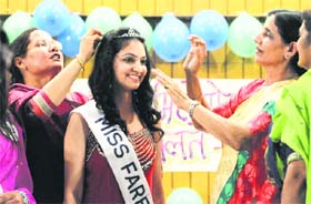 Kanika Saini of BA III is all smiles after being crowned Miss Farewell at Ramgarhia Girls College in Ludhiana on Thursday