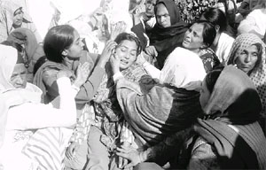 People console a family member of slaim CRPF jawan Tilak Raj at Bharoli village in Nawanshahr on Thursday.