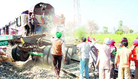 A truck driver suffered serious injuries when a goods train rammed into his vehicle at an unmanned crossing on the Bathinda-Jakhal link near Khokhar Kalan village in Mansa on Thursday.