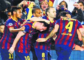 Barcelona's Lionel Messi (second from left) celebrates with teammates after scoring against Manchester City in their Champions League last 16 second leg match in Barcelona on Wednesday