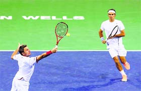 Stanislas Wawrinka and Roger Federer beat Leander Paes and Radek Stepanek 6-3 6-7(6) 10-4 in the doubles quarterfinals of the BNP Paribas Open at Indian Wells on Wednesday