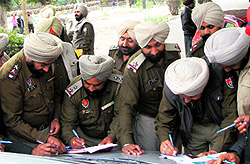 Policemen queue up for assigning duties at the Police Lines in Amritsar