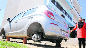 A car supported on bricks after miscreants stole its tyres at Sector 78, Mohali ,on Friday.