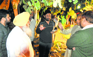 Mayor HC Kalyan and MC officials try to pacify angry residents. 