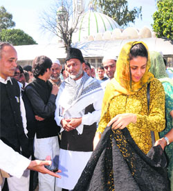 AAP nominee Gul Panag buys a suit outside the Jama Masjid in Sector 20, Chandigarh, on Friday.