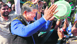 Chief Minister Harish Rawat celebrates Holi in Haridwar on Friday.
